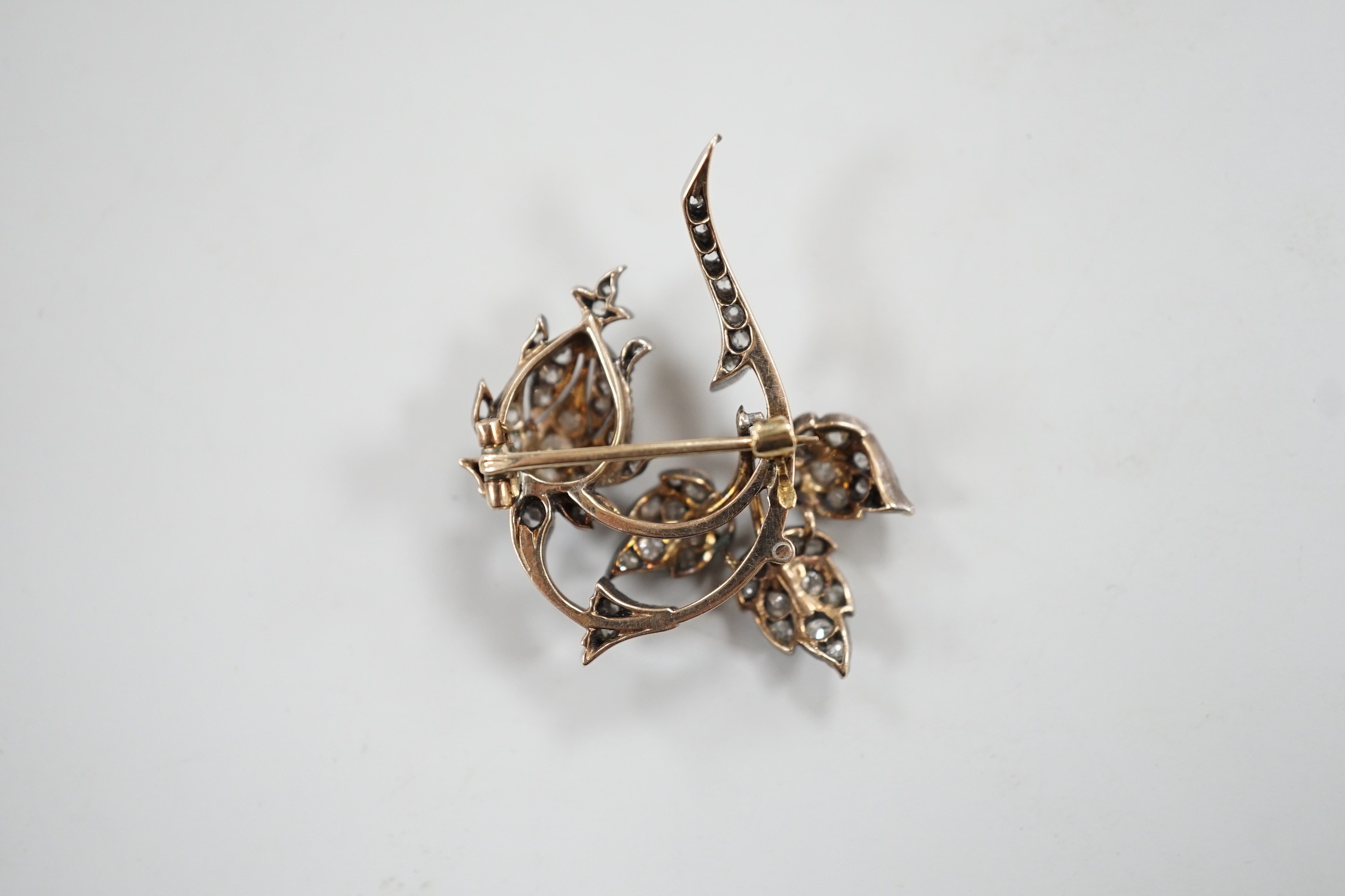 A Victorian yellow and white metal and diamond cluster set spray brooch, 38mm, gross weight 8.9 grams.